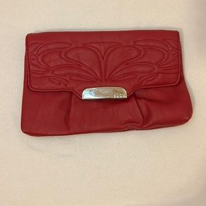 SOLD. Elle red clutch with silver chain detail.